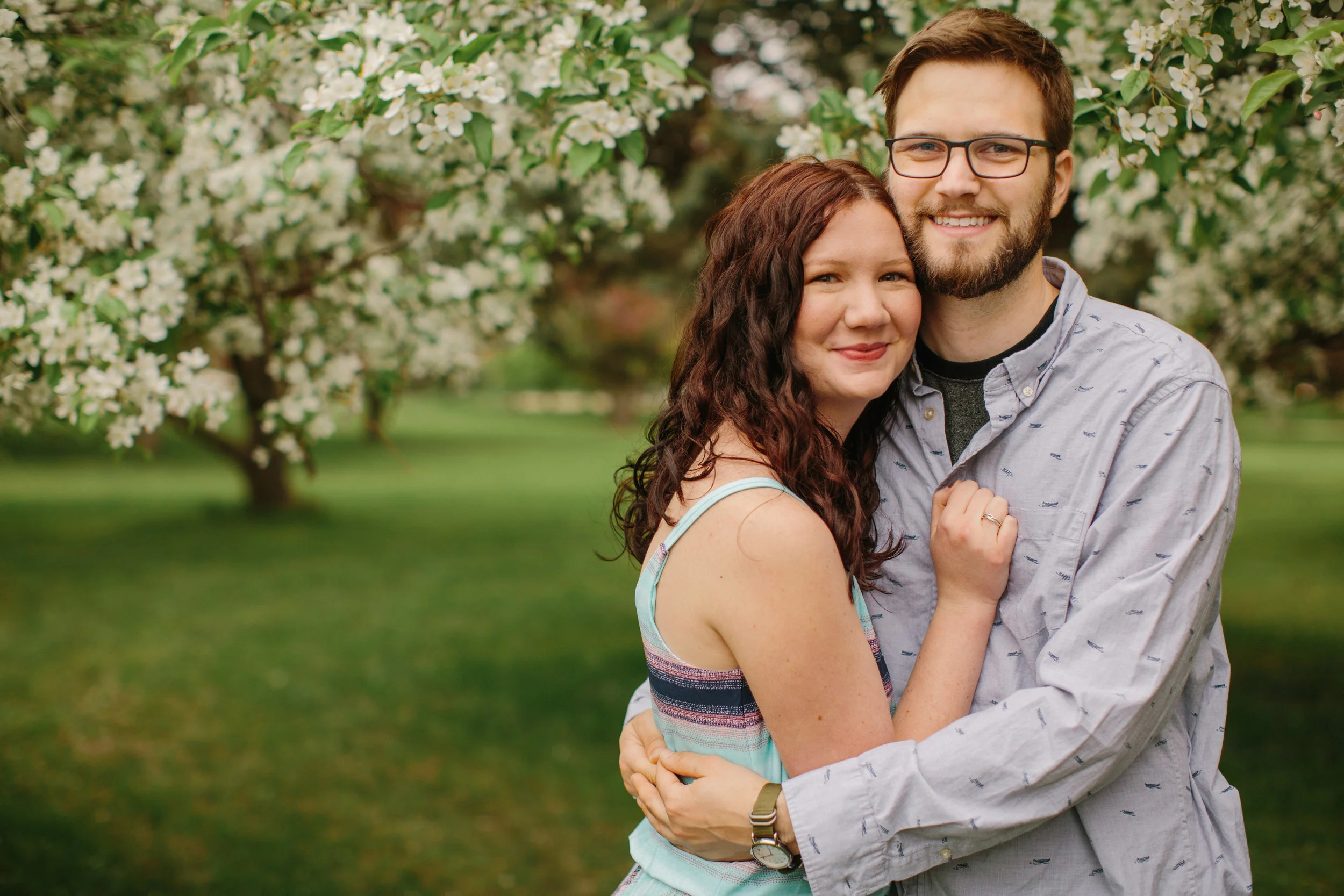couple smiling and hugging wedding photographers in des moines iowa