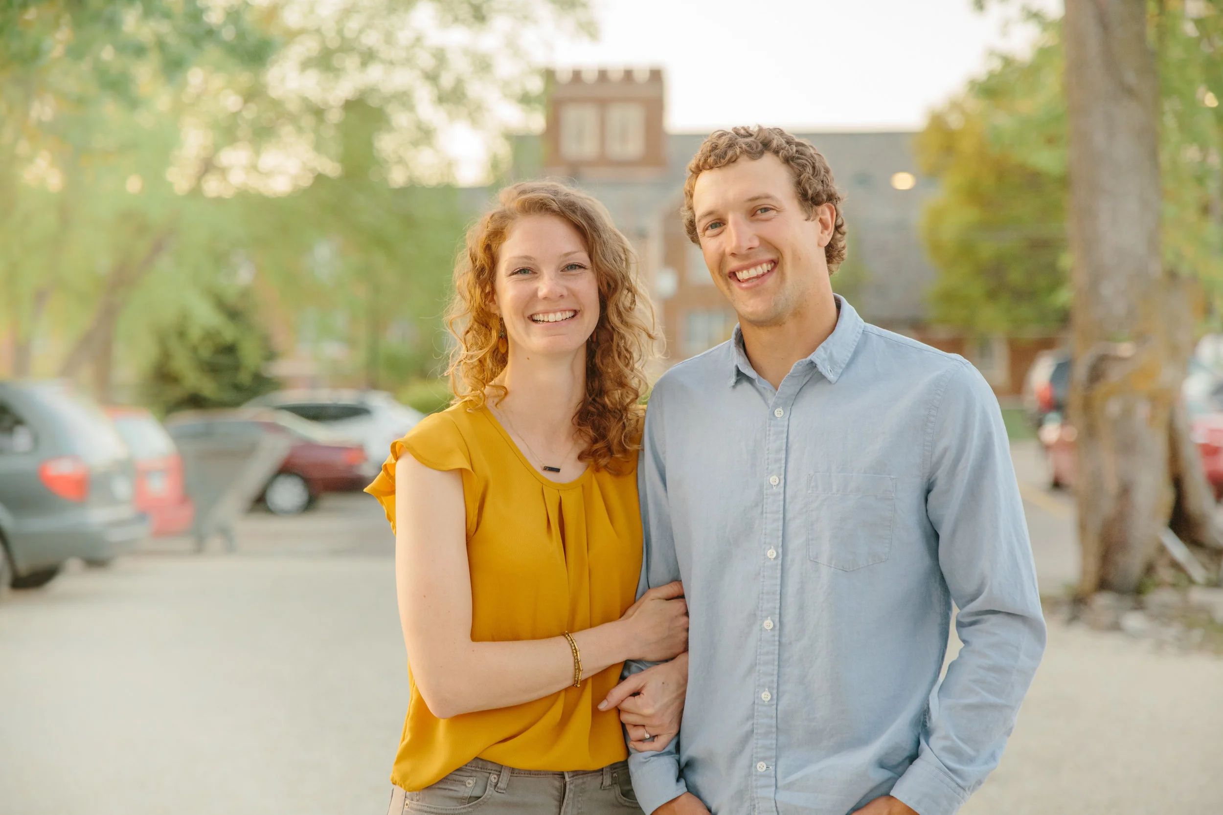 des moines sunny evening engagement photos laughing beaverdale