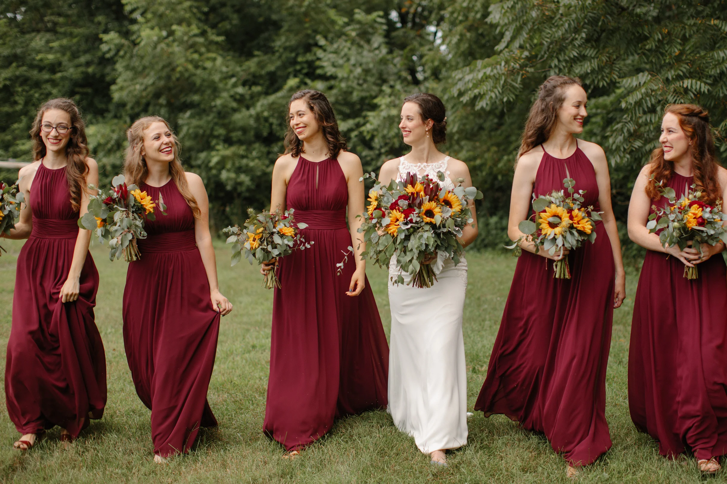 elegant bridesmaids walking together with bride des Moines wedding photography