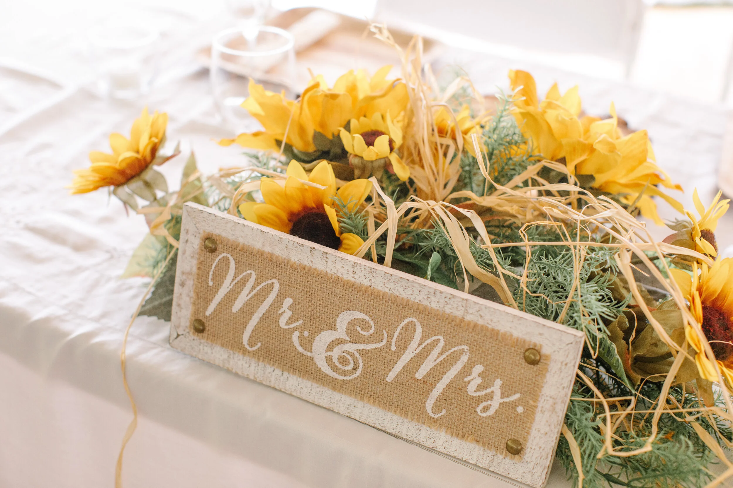 sweet sunflower themed country barn wedding reception iowa des moines