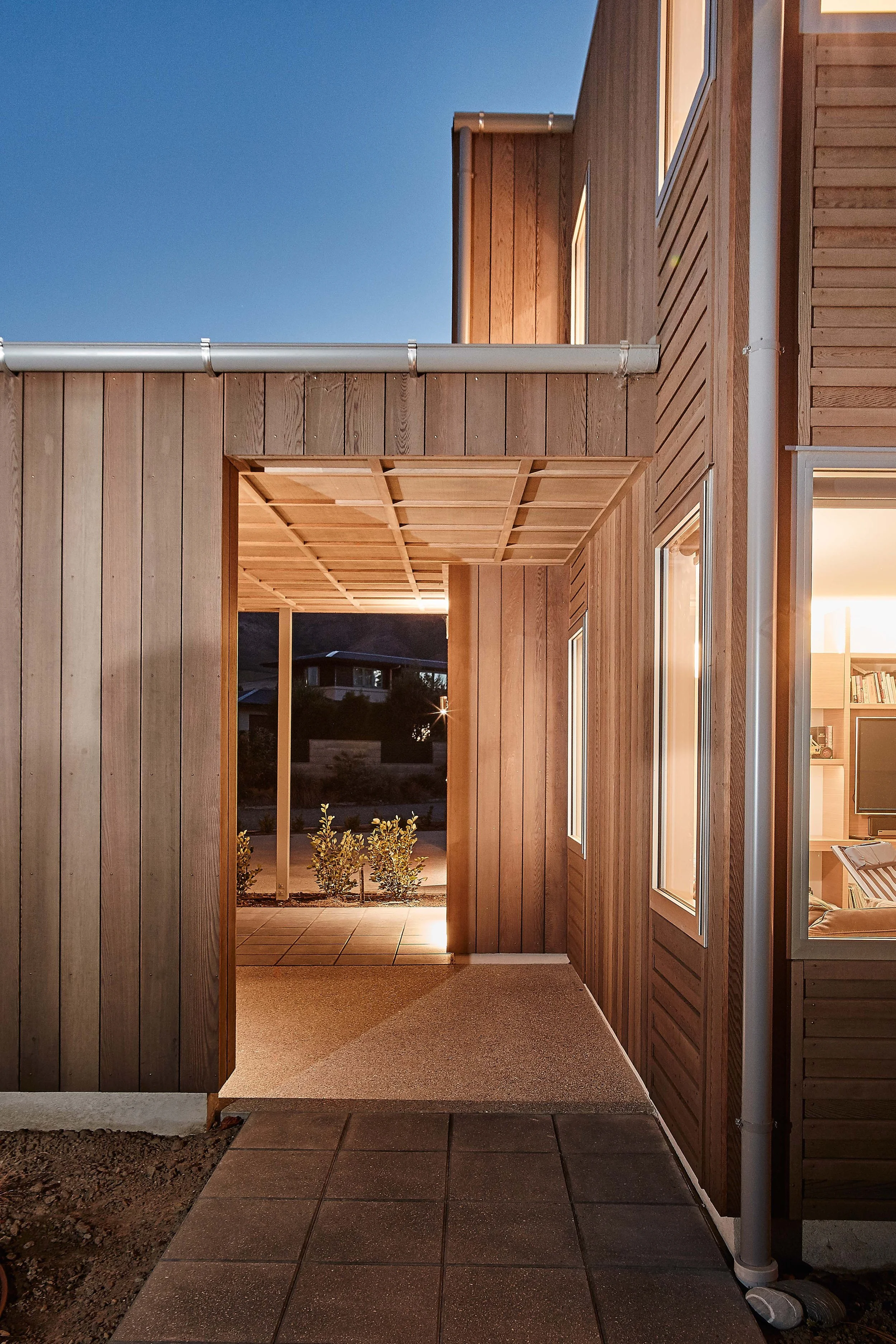 Wanaka House designed by Fraser Cameron Architects Ltd. Entry. Western Red Cedar Cladding and Battened Ply Soffits. 