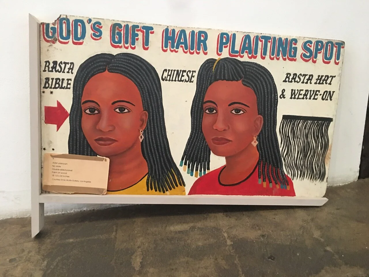 God's Gift Hair Plaiting Spot, double-sided sign, c. 1990s, Ghana, paint, wood, 18" x 32"