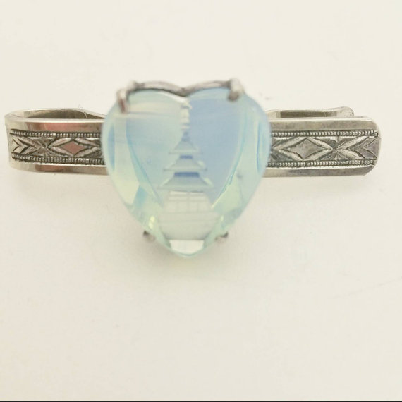 You can purchase this vintage tie bar for $40- from LadyandLibrarian .