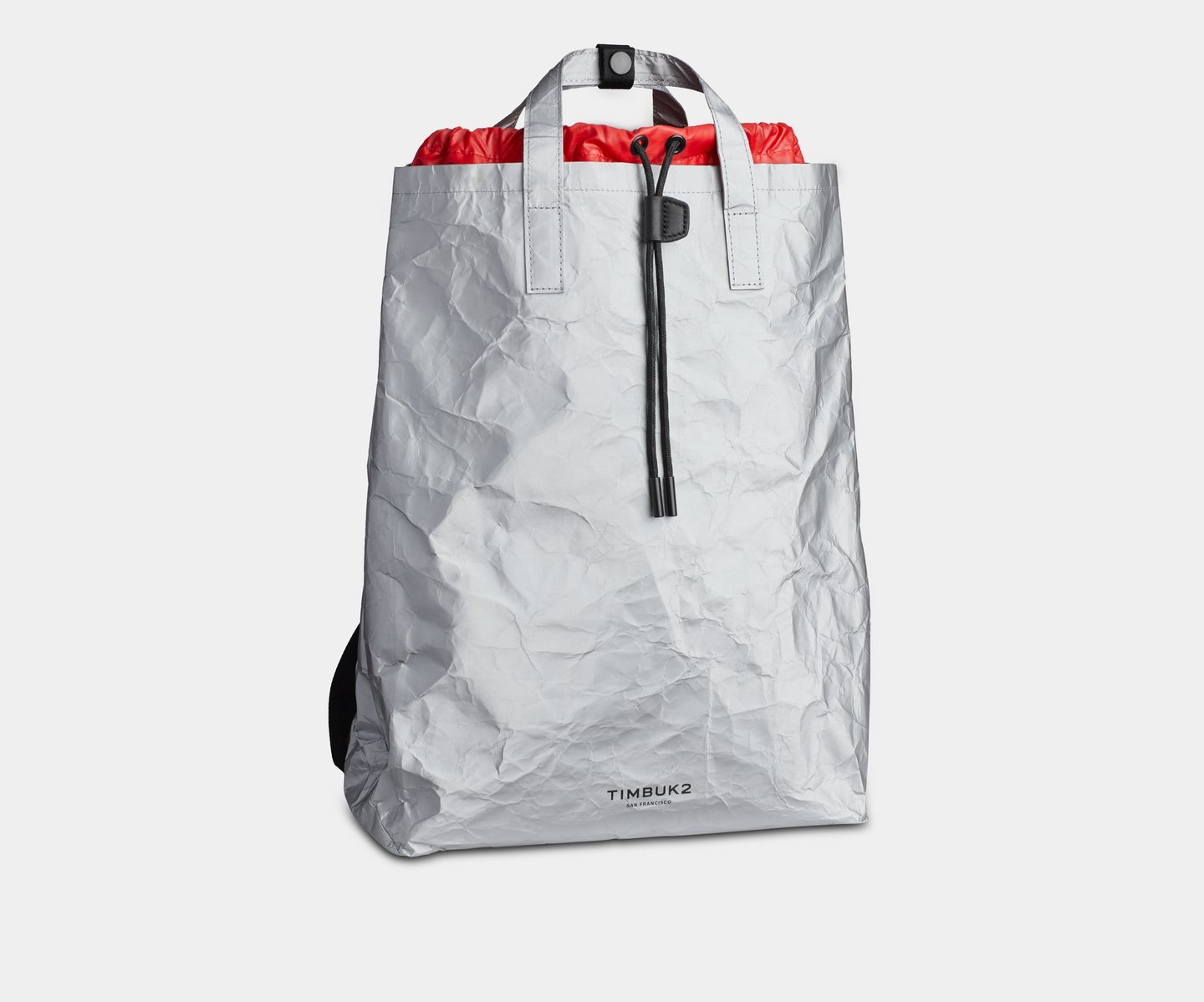 timbuk2-pack-dave-ortiz-paper-bag-backpack-combo-silver_5220-3-7250_front-Timbuk2-e3c3c3c30303030b-1989_1440x.progressive.jpg