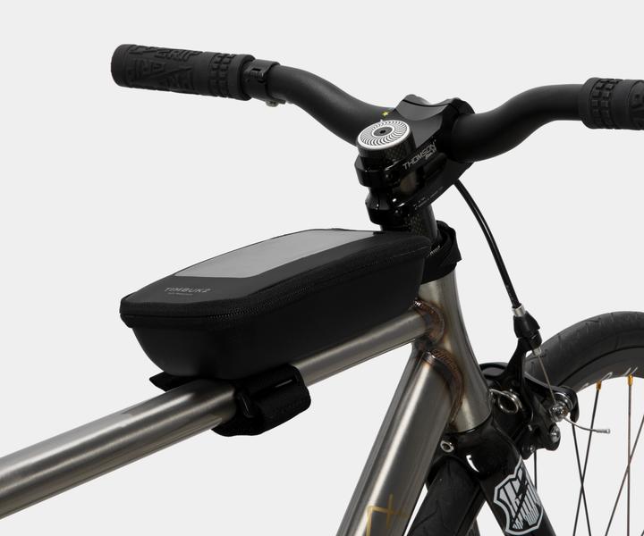 It allows you to use your phone while on your bike. It has extra space for power bank or small items.