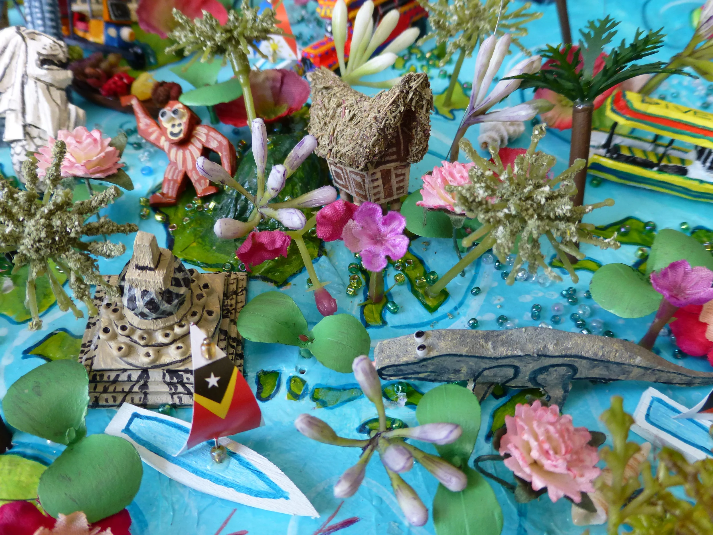 World Map - Indonesia Detail: Borobudur, Borneo, Komodo Dragon and Toraja House, Sarawak