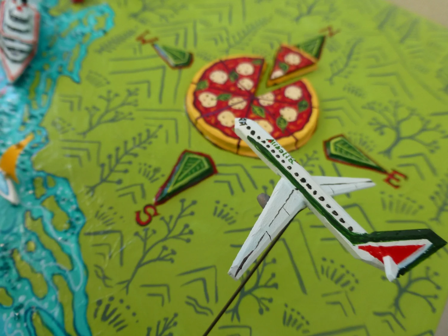 Alitalia and Compass styled as a Pizza