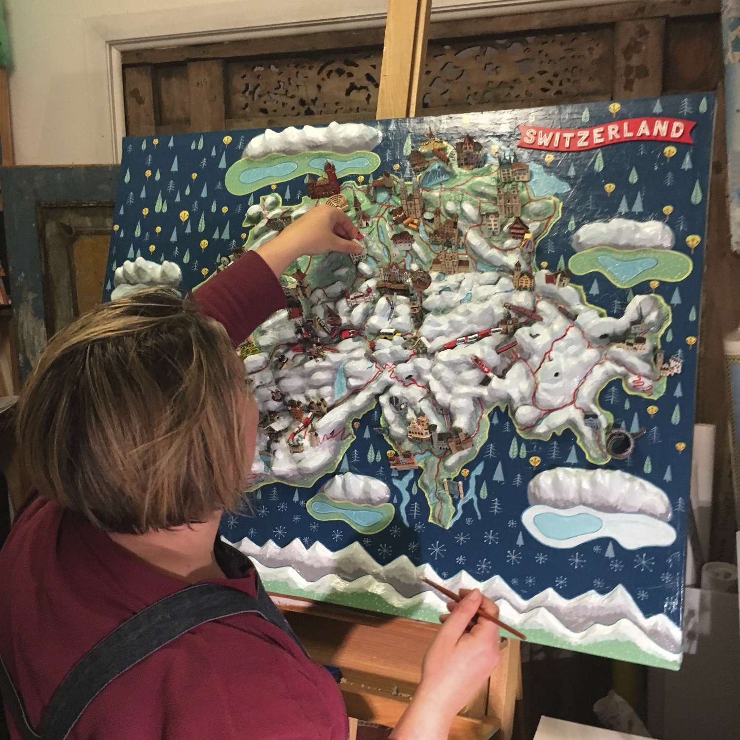 Adding the hand carved features to the relief map base of Switzerland