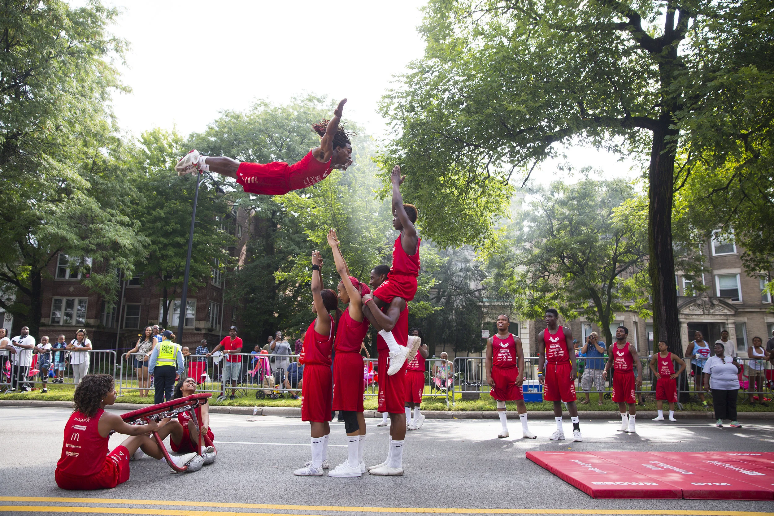  The Jesse White Tumblers perform in the Bud Billiken Parade on Saturday, August 13, 2016, in Chicago. 