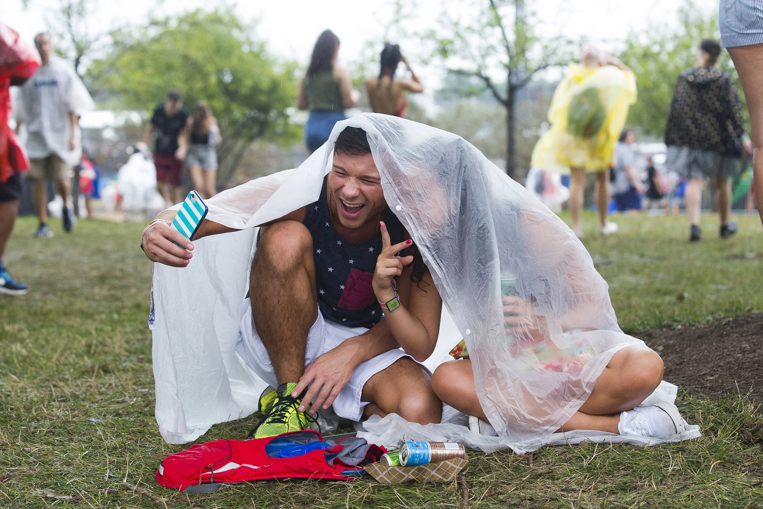  Ryan Carballido, left, and Janelle Carballido take a selfie while trying to stay dry at Lollapalooza on Friday, July 29, 2016 in Chicago. 