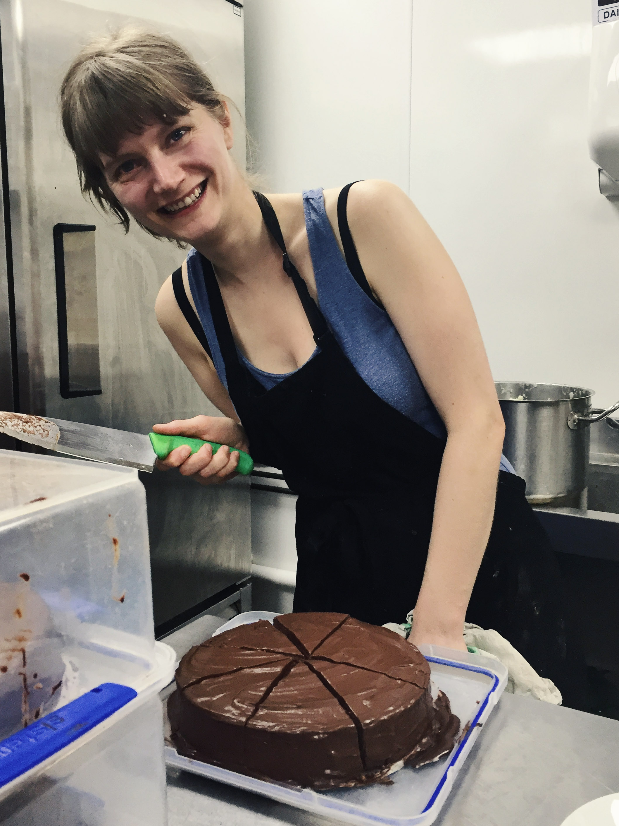 Rebecca slicing the cheesecake (high on chocolate! it's fair to say we made far too much topping..)