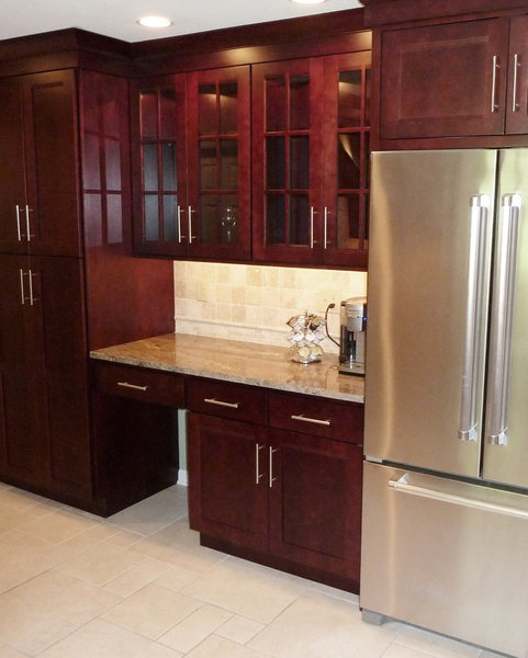 A&E Construction Glass Front Cabinets Stainless Appliances optimized.jpg