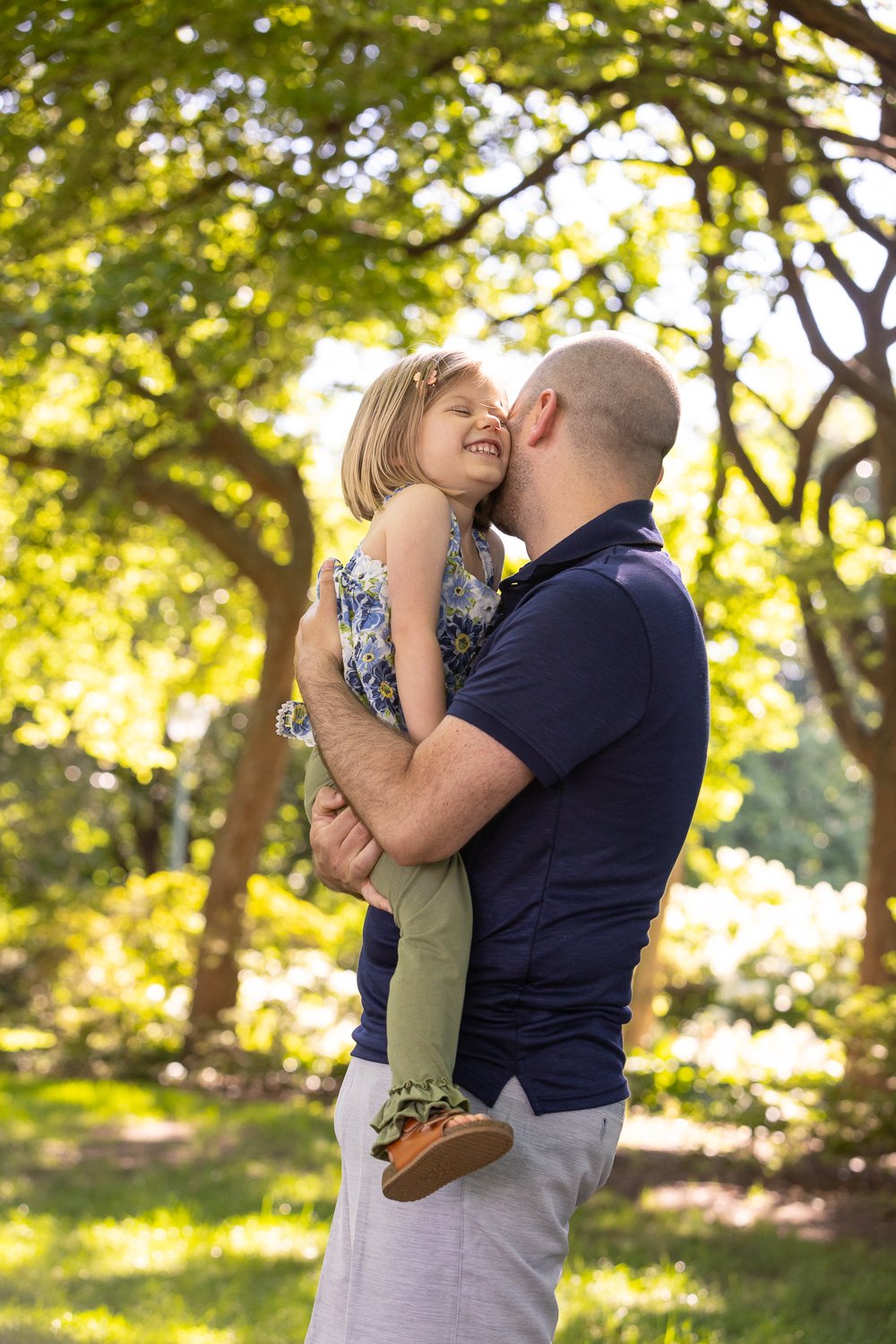 Candid outdoor lifestyle portrait of preschooler and father near the U.S. Capitol in Washington, D.C.
