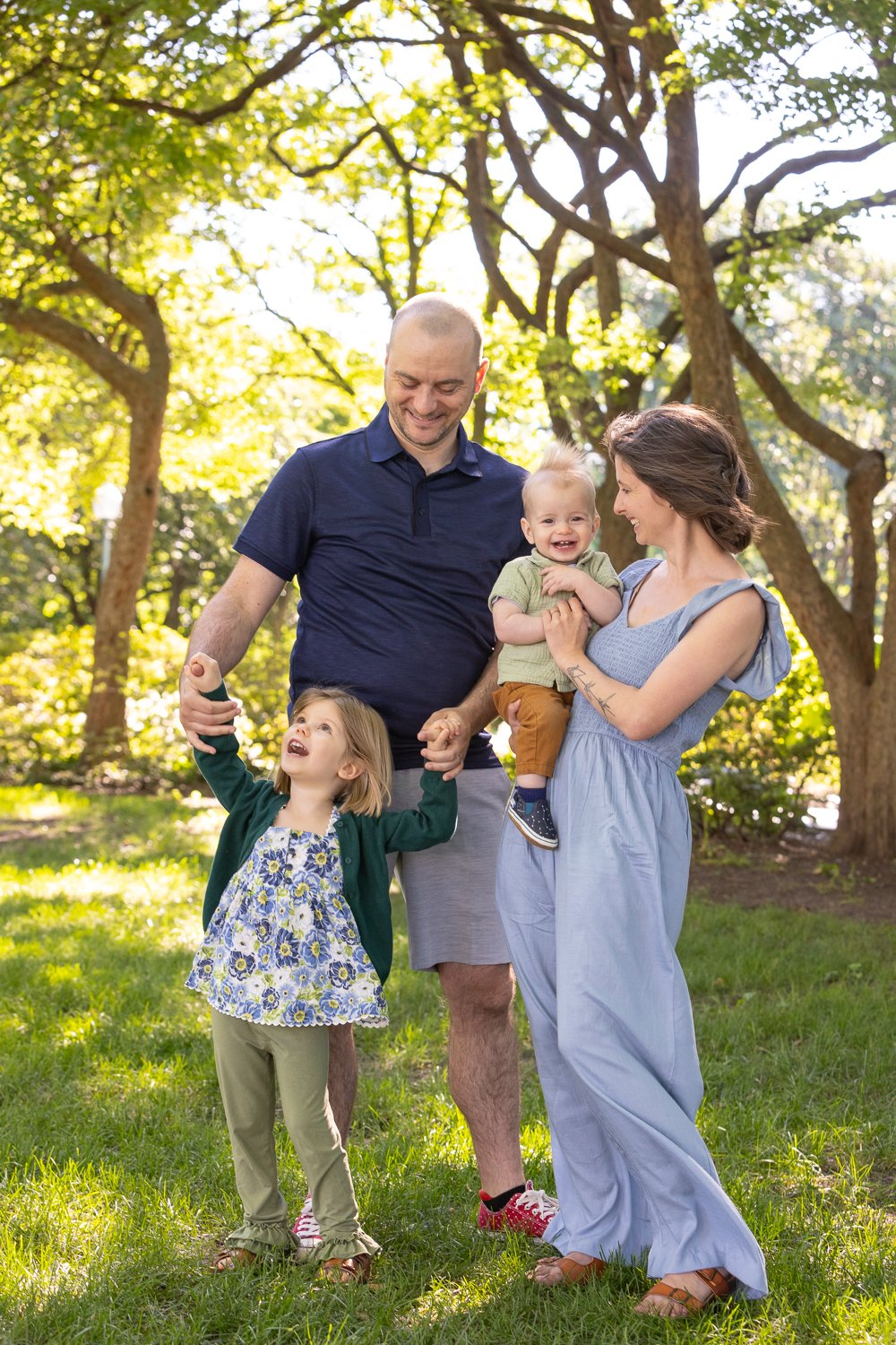 Candid outdoor lifestyle portrait of young family near the U.S. Capitol in Washington, D.C.