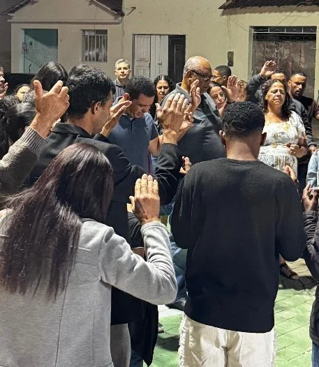 Church service in street reaching neighborhood