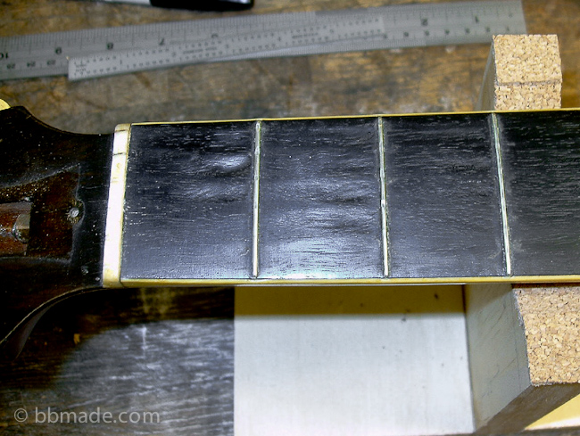 1929 Gibson L-3 after decades of playing, a decade stored in a shed outside only in a chipboard case. The wear in the fingerboard was something I wanted to save but it...to save it in this particular case meant the playability of the guitar would suffer.