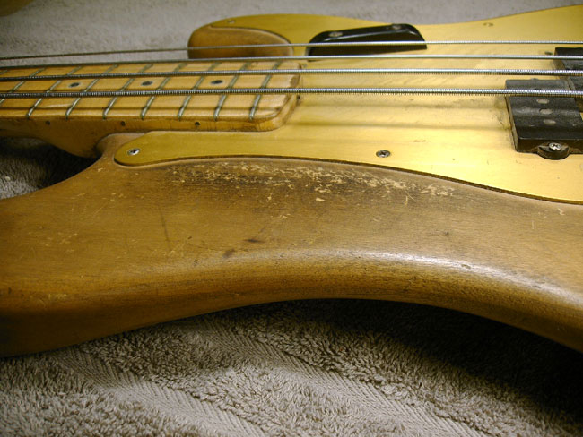 Figure 1 - 1958 Fender Precision bass with the finish stripped off by the owner. Once he realized how hard the job was he quit, leaving the wood exposed to the elements and also ruined the value.