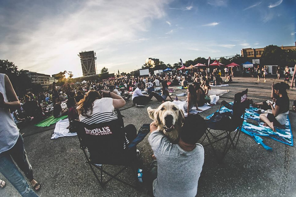 The William Vale Hotel rises in the distance as the Summer Screen crowd prepares for an outdoor movie.