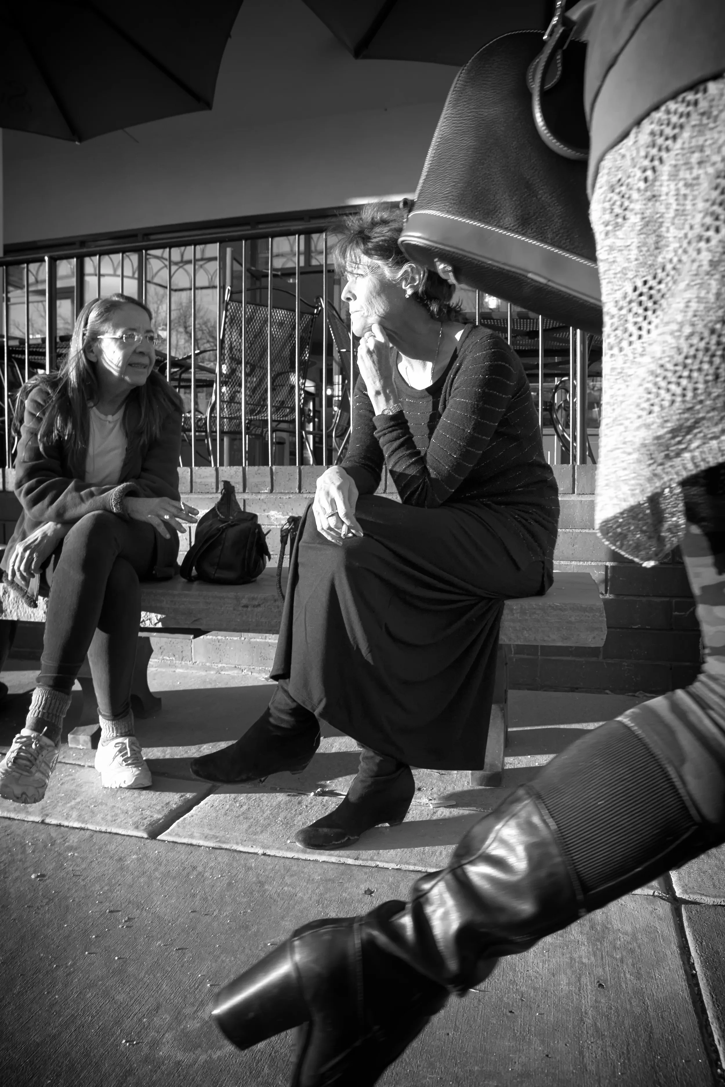 Ladies enjoying a cigarette at the end of a long day.