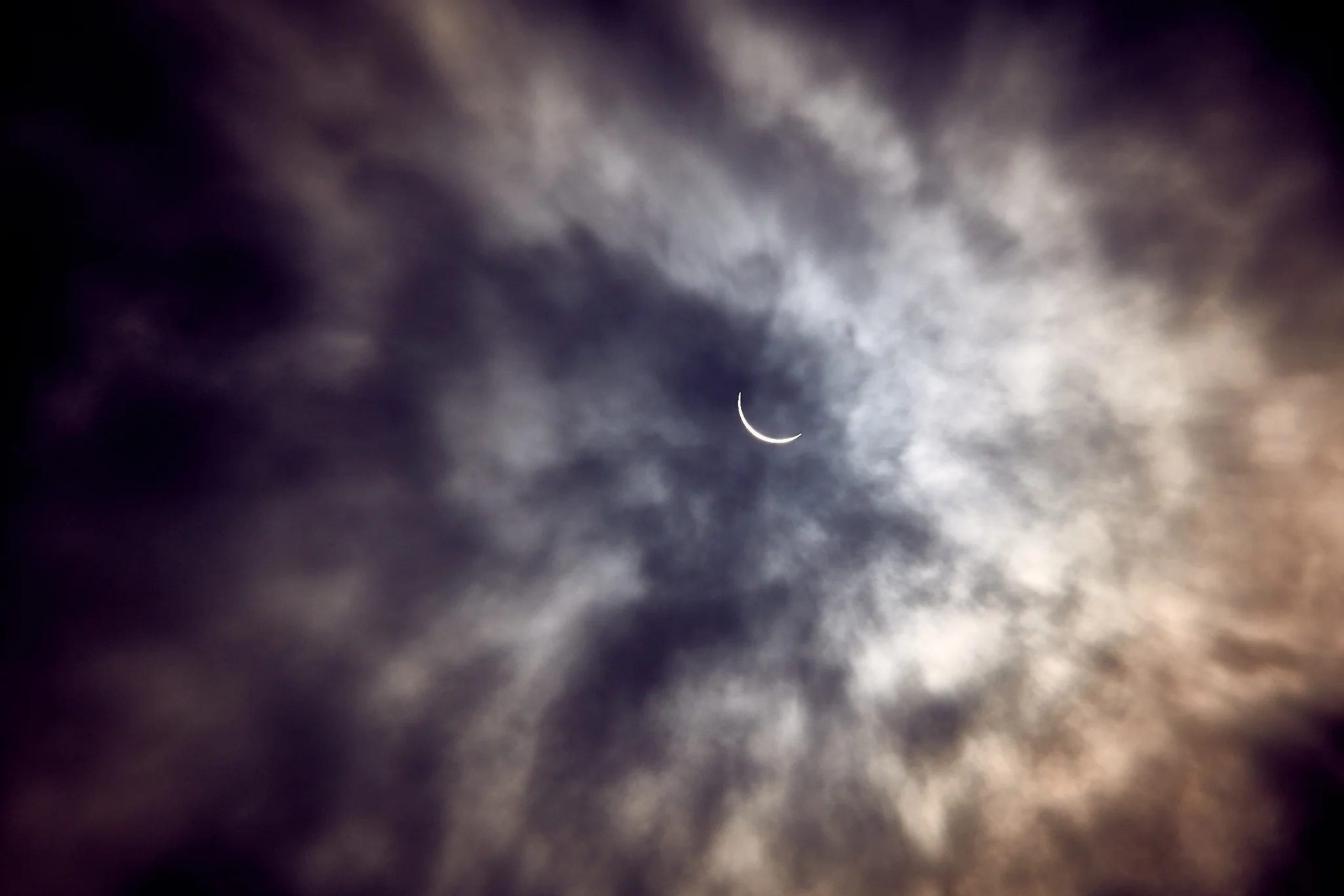A cloud hovering over the eclipse just before totality which allowed me to capture this without the use of a solar filter. 1/500s * f/6.3 * ISO 100 * 200mm