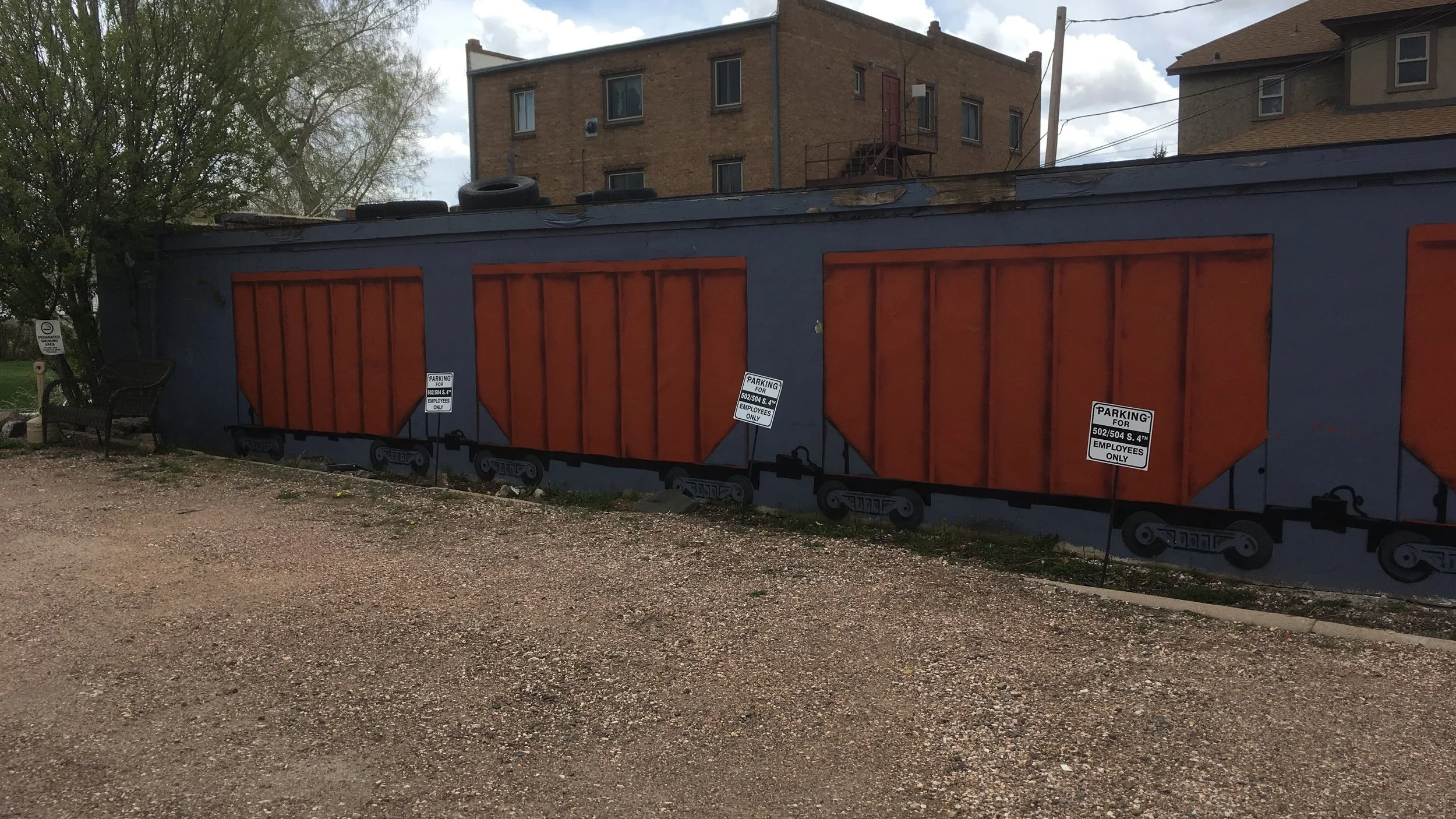 Artist Dan Toro “preps” the wall for his first spray paint workshop to break in the Free Wall