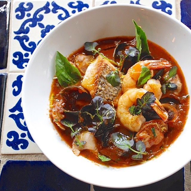 Cioppino. Black Bass. Shrimp. Mussels. Littlenecks. Watercress. Basil.