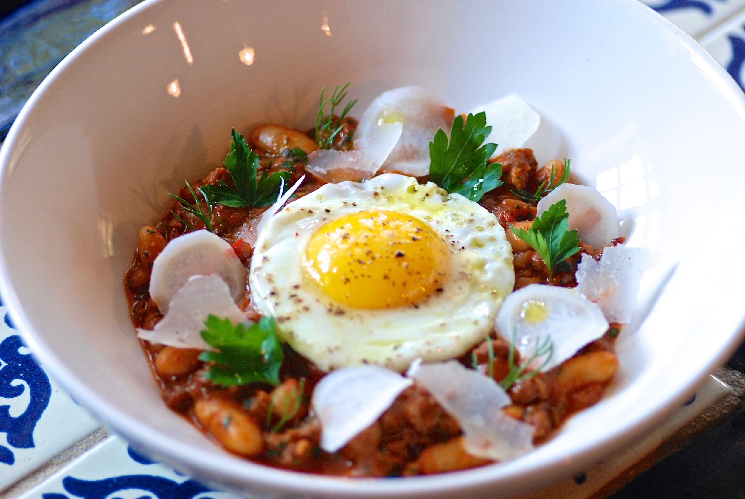 Romesco. Egg. Cannellini. Sausage.