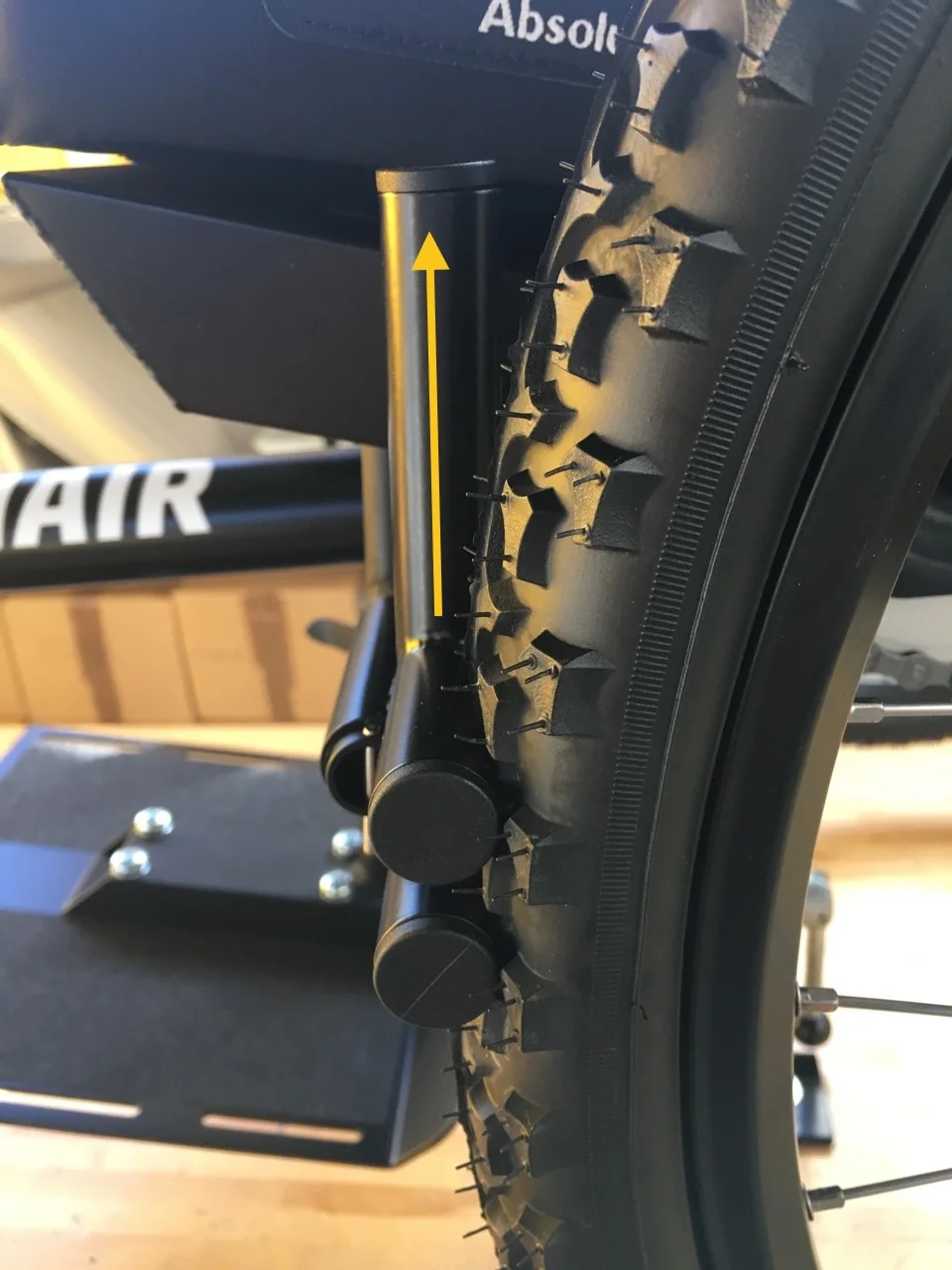 Fully engaged. Less wheel compression than at 90 degrees, but enough to hold the wheel in place. Angle = 180 degrees.