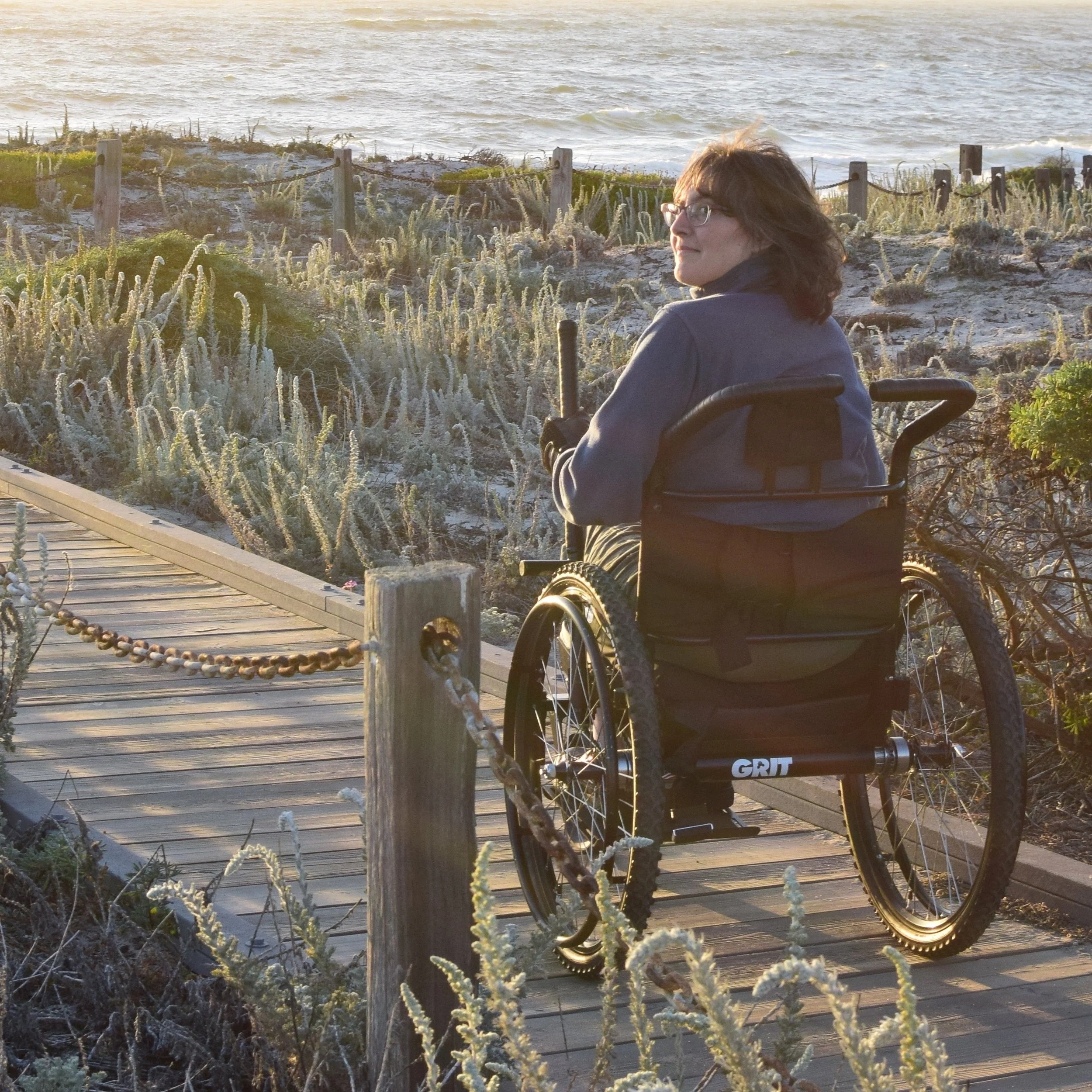 “My main goals were to find something that would roll over rocks, roots, and small steps. I wanted something that would work on mud, sand, and snow. Ideally, this chair would also move forward as well as stop in rain.” Read more from Jenny here.