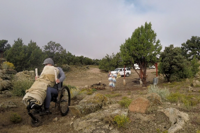 Bringing up our large, canvas sleeping bag balanced on the front wheel arm of my Freedom Chair!