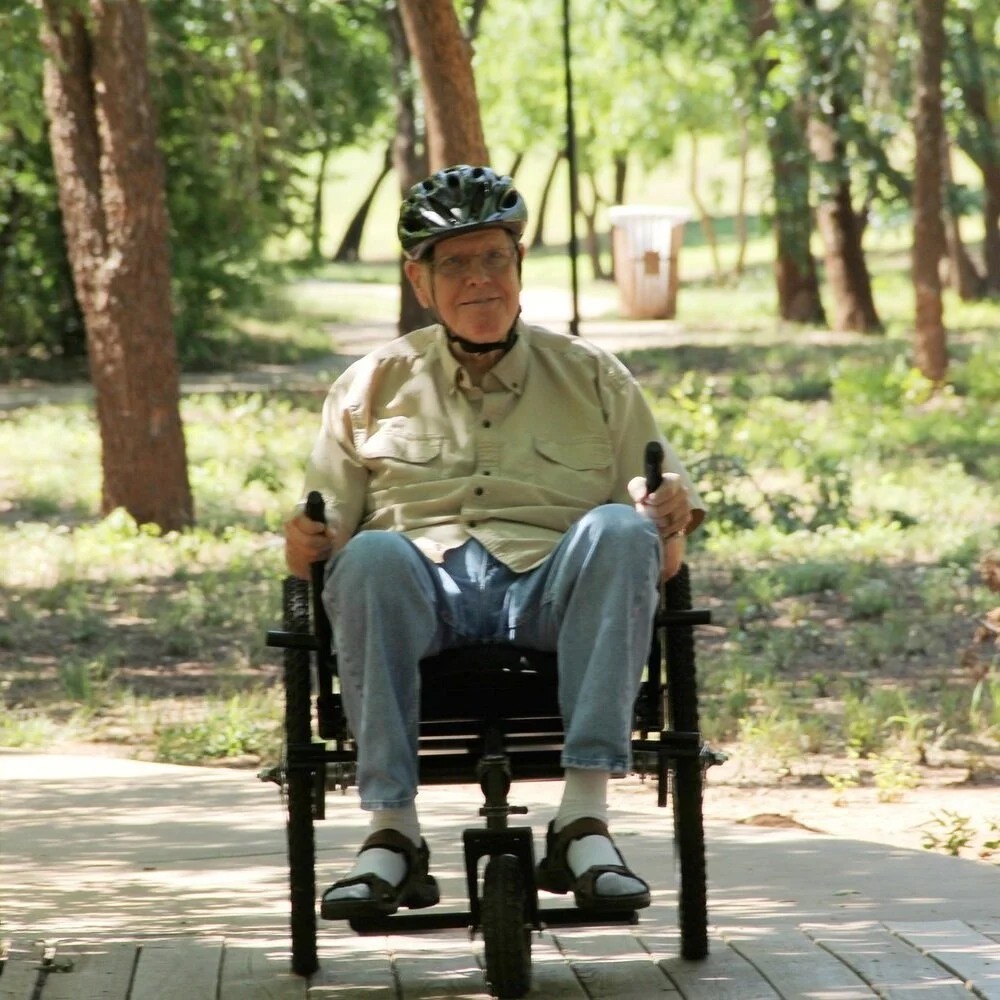 Jack lives with Chronic Inflammatory Demyelinating Polyneuropathy (CIPD). He typically uses a cane or regular manual wheelchair, he found it challenging to get where he wanted to while pursuing his passion of photography. "I was able to roam freely at our annual Arts for All Festival, and tour the event booths for the first time in 6 yrs. I saw many old friends for the first time in a long time, and am very grateful for my Freedom Chair which made it all happen." Read more about Jack