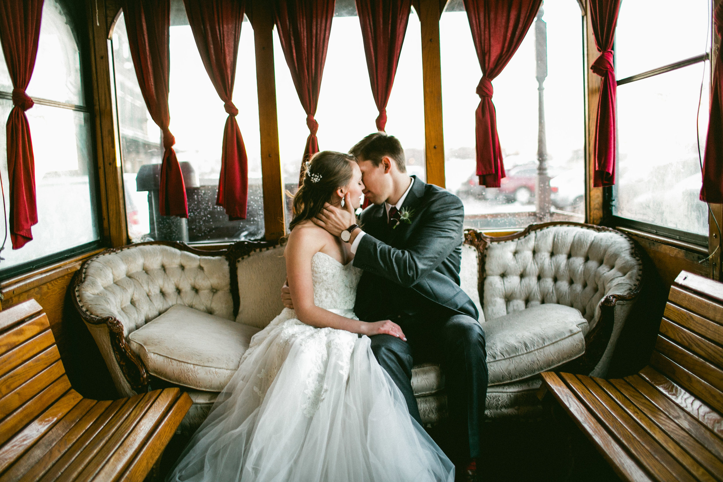 Couple Kissing in Trolley on Wedding Day