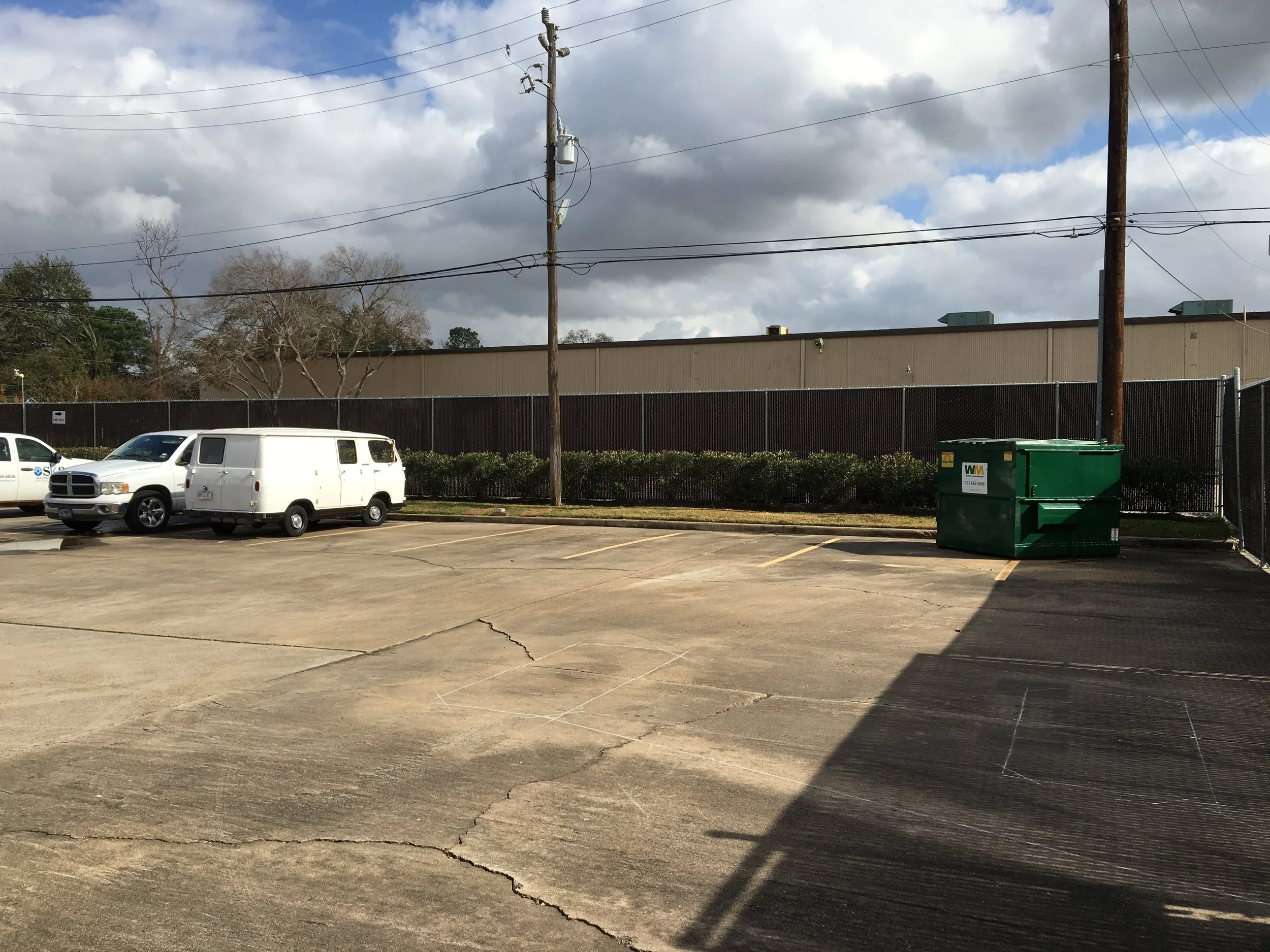 Back parking lot dumpster