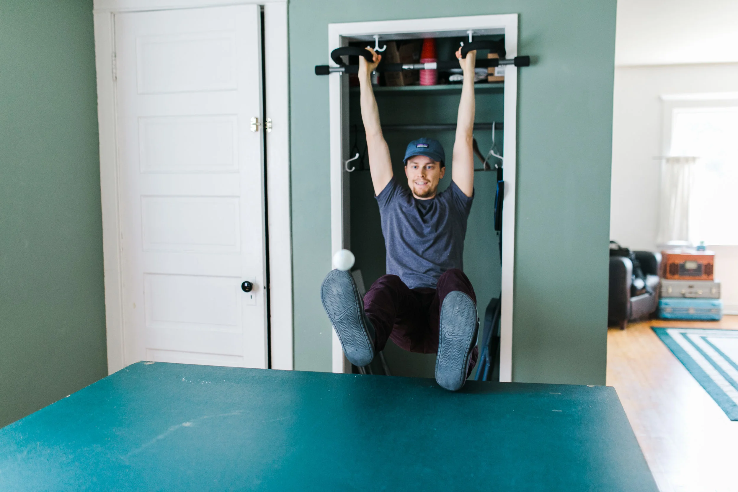  Dylan took it up a notch by putting on his sandals and hanging from their pull-up bar to play against Marisa, hahaha. 