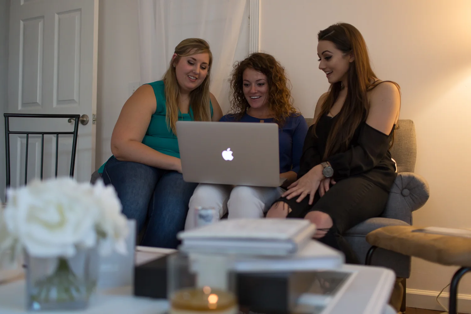 Three girls looking at computer 