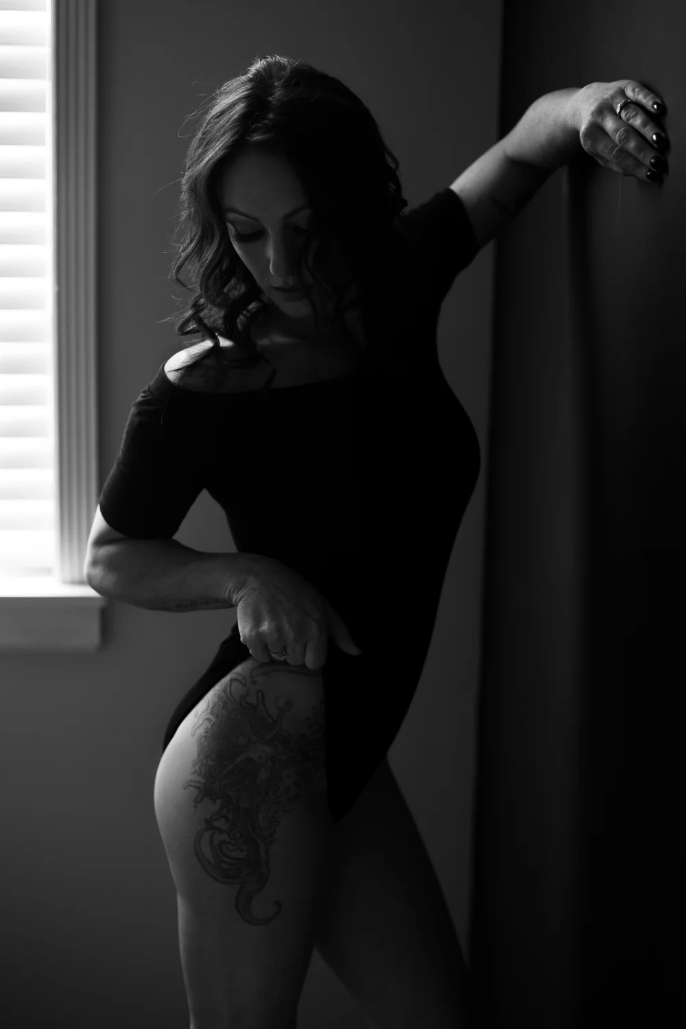 Black body suit, mermaid leg tattoo