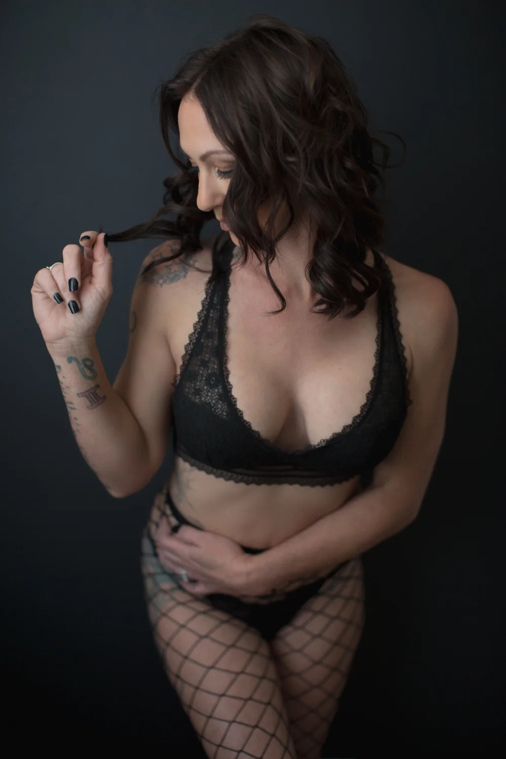 Athletic woman wearing waist high fish net stockings