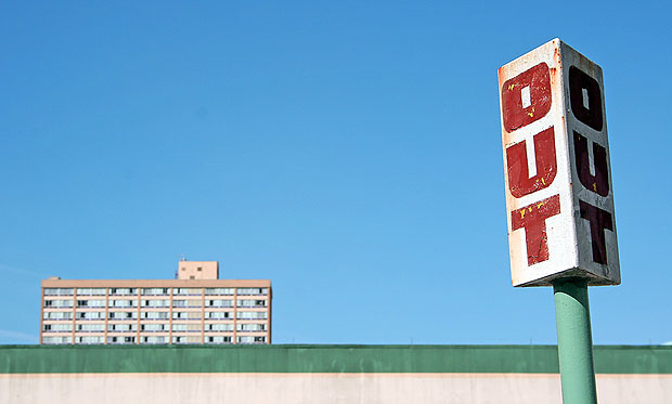 Here, the visual "weight" of the road sign is balanced by the building on the other side of the shot. Image by Shannon Kokoska .