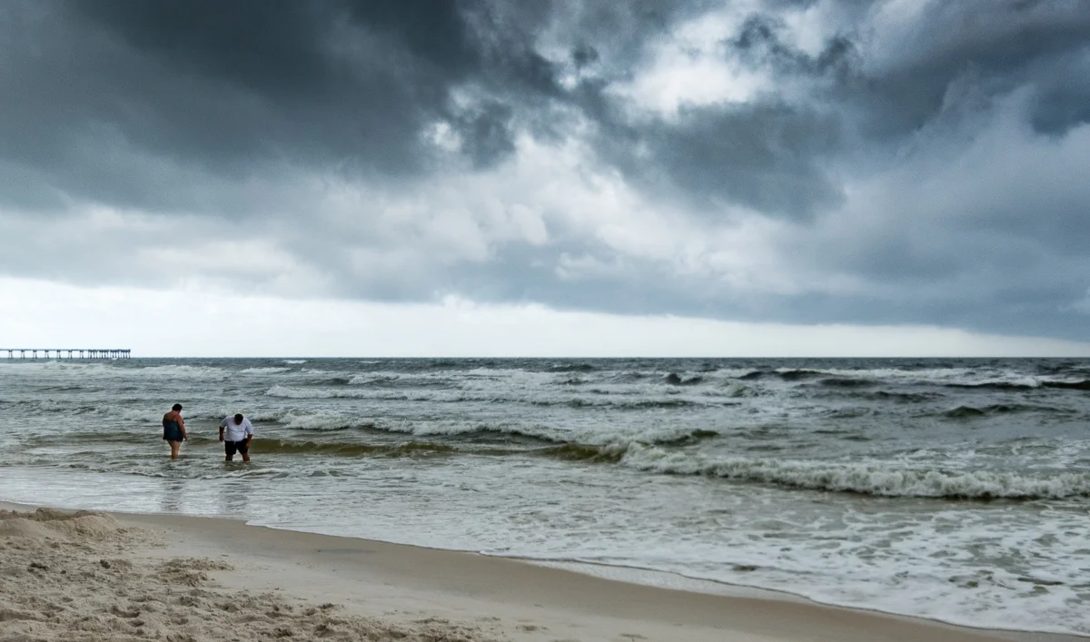 "Testing the fates". (c) Rebecca LaChance, 2016. Panama City Beach, FL. Despite double red flags, beach patrols with loudspeakers, airplanes with banners, these folks (and many others) wandered out into the waters.