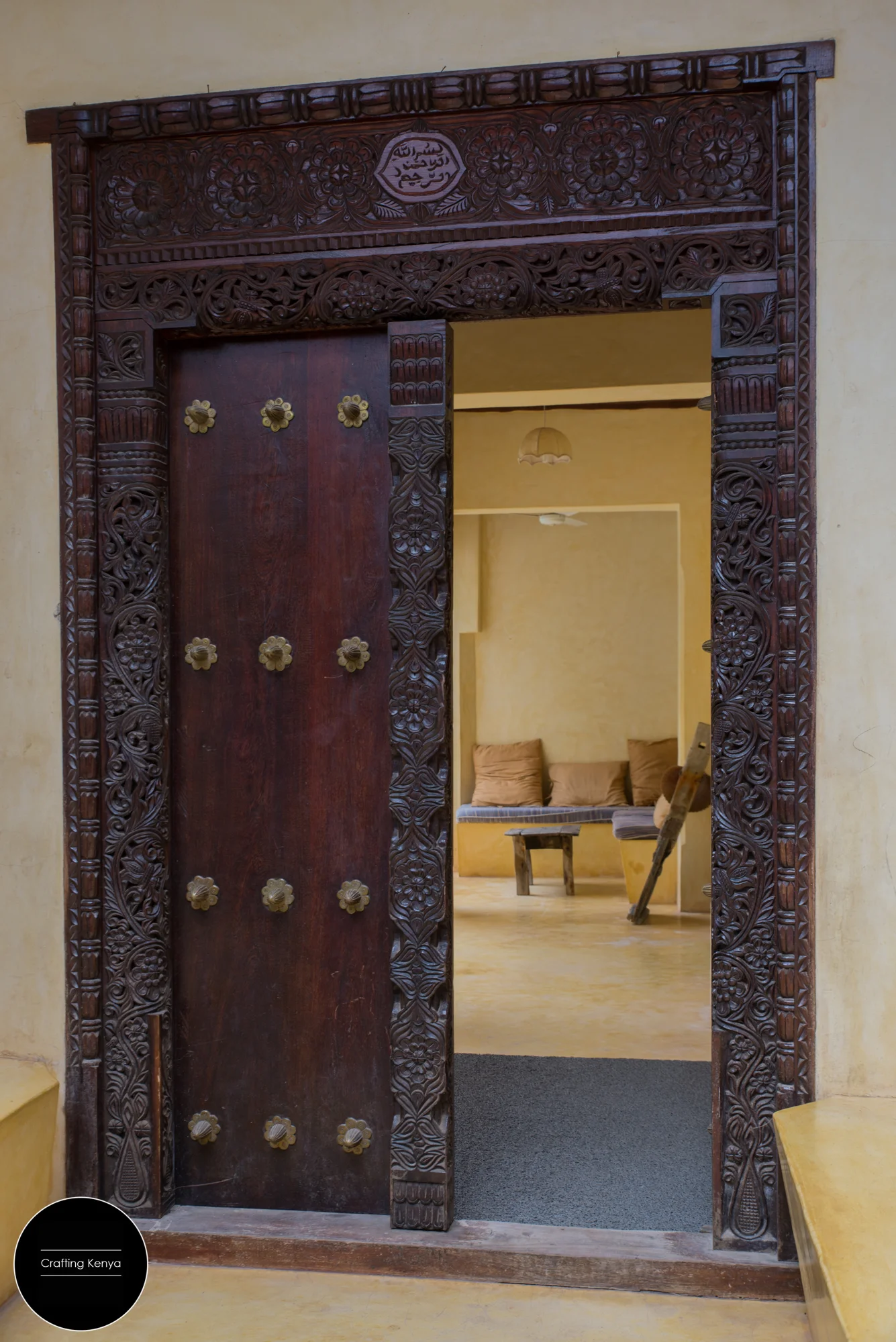 New Lamu door decorated with brass fittings that were in the past meant to deter elephants and other wild animals