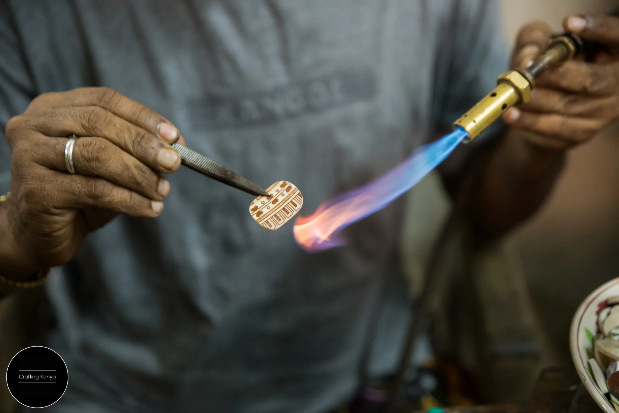 Ali Slim the jeweler at work. Preparing a piece of ceramic dating back to the Indian Ocean trade