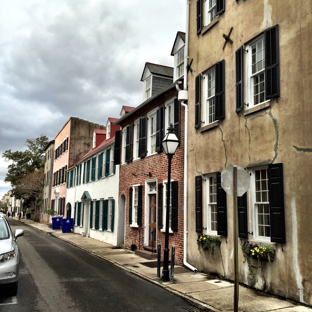 The windows and shutters create that common element that link the buildings.