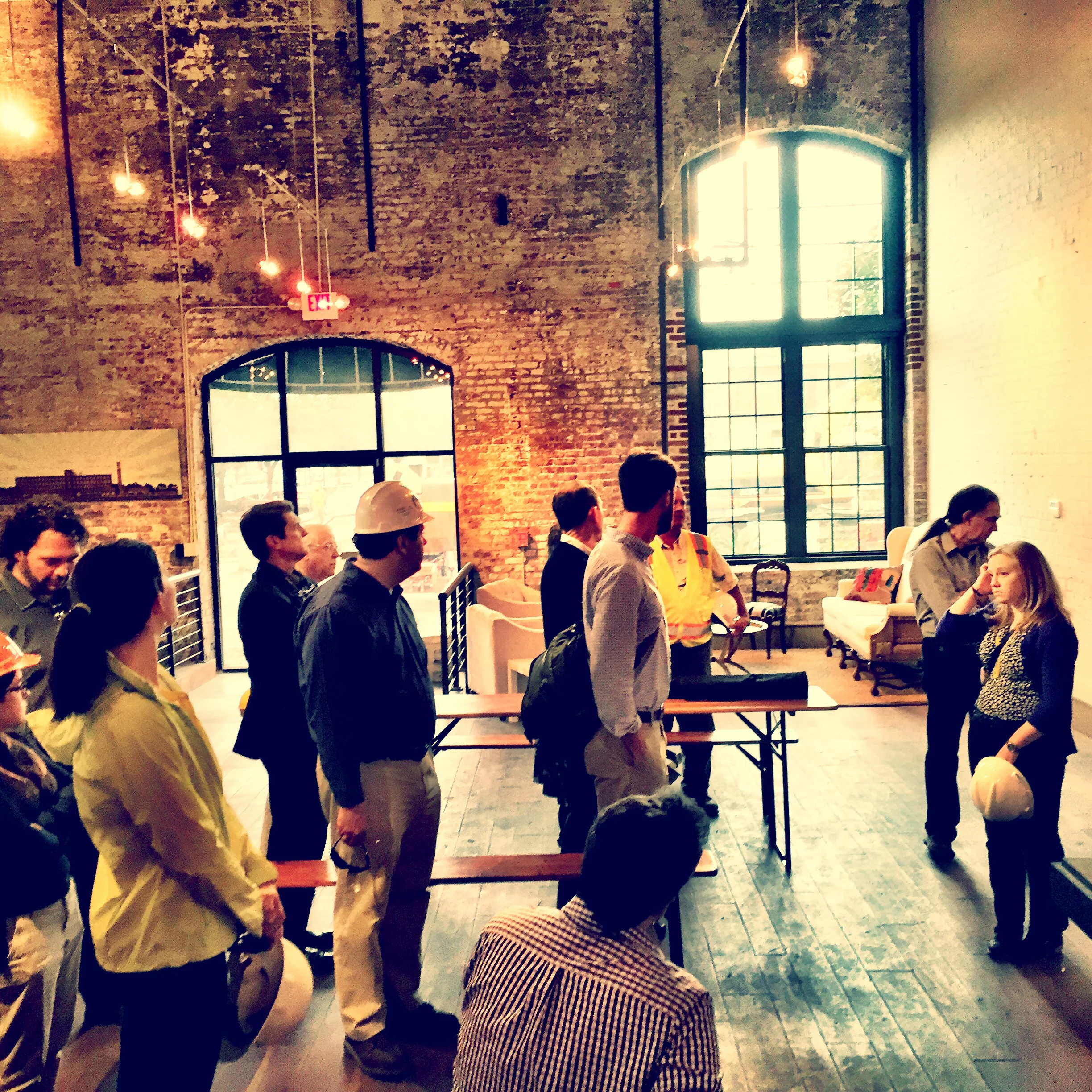 Eager architects waiting for their tour! This is the leasing office.