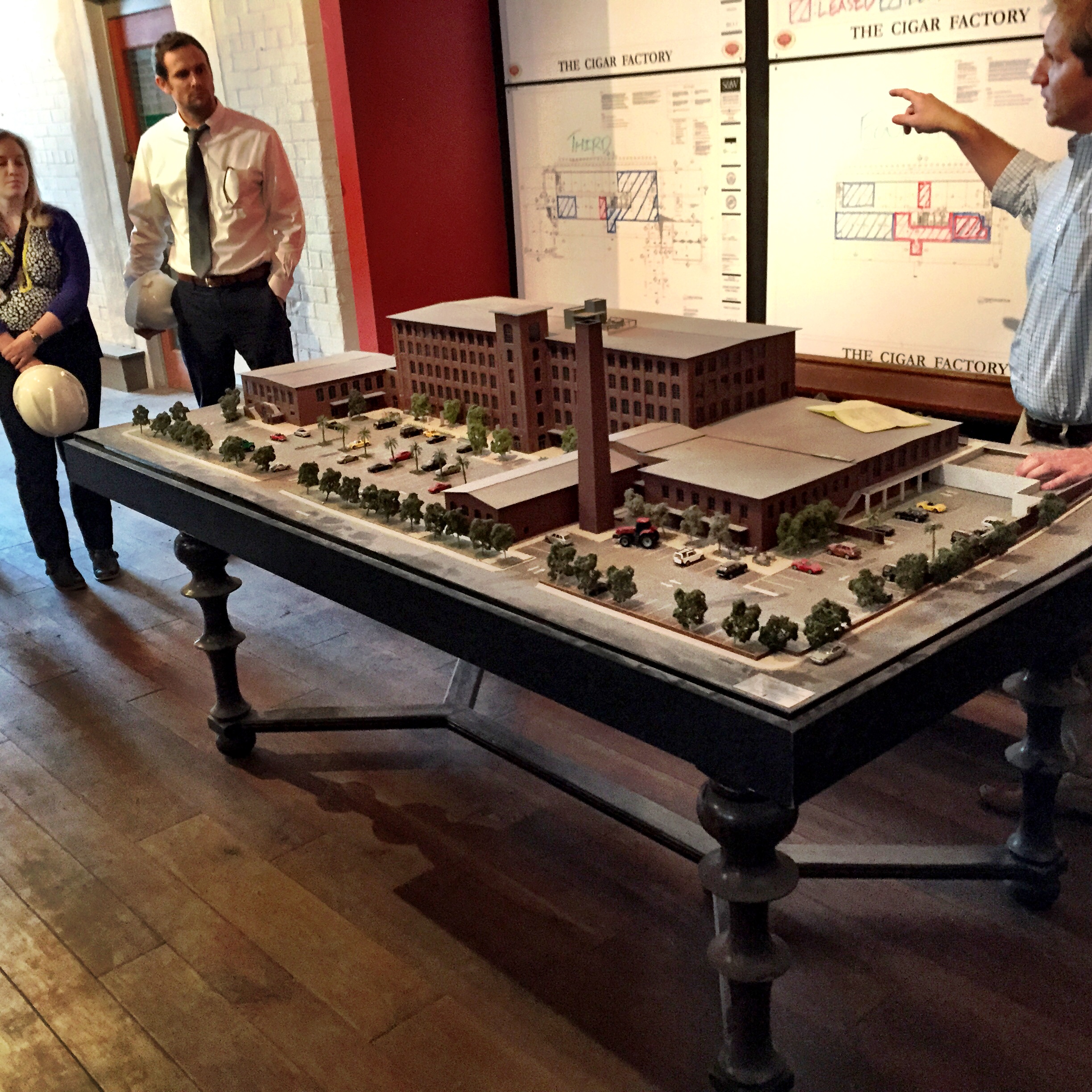 To the right is Todd Bullwinkle with Trident Construction giving us the skinny on the project. That is the model of the Cigar Factory.