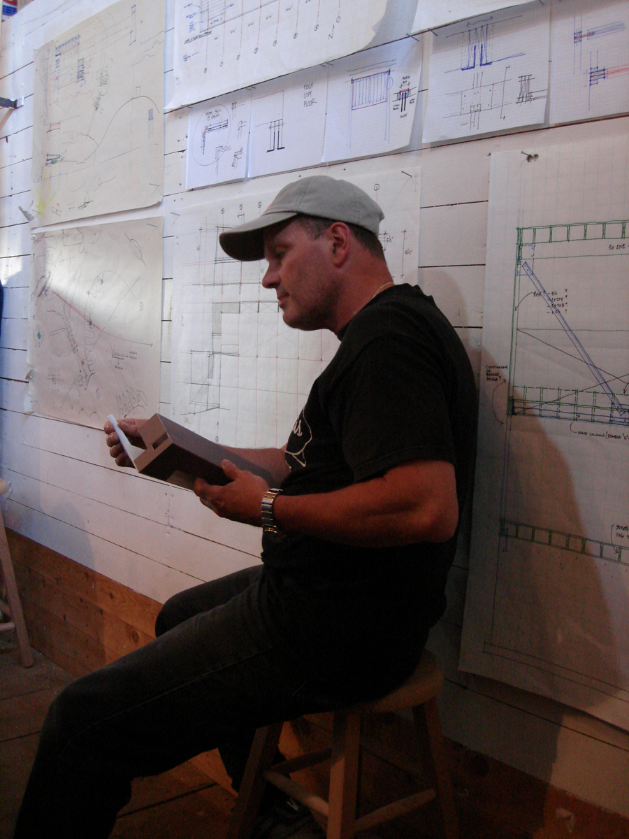 This was during one of the many pinup settings. The working drawings were pinned up on the wall. Scratch that. They were nailed up on the wall.