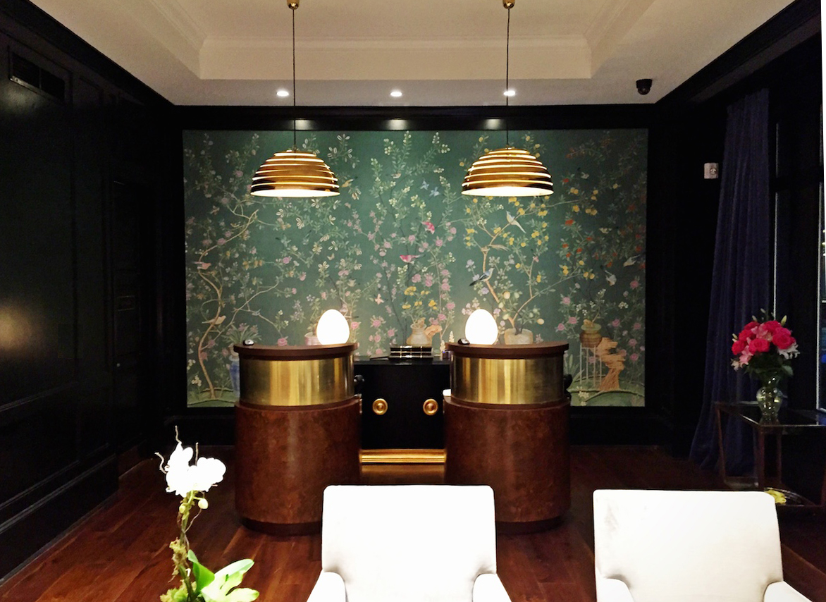The reception kiosks at the Spectator were custom made for the hotel. The light fixtures are vintage and the wall covering hand-painted. Every piece is extremely custom.