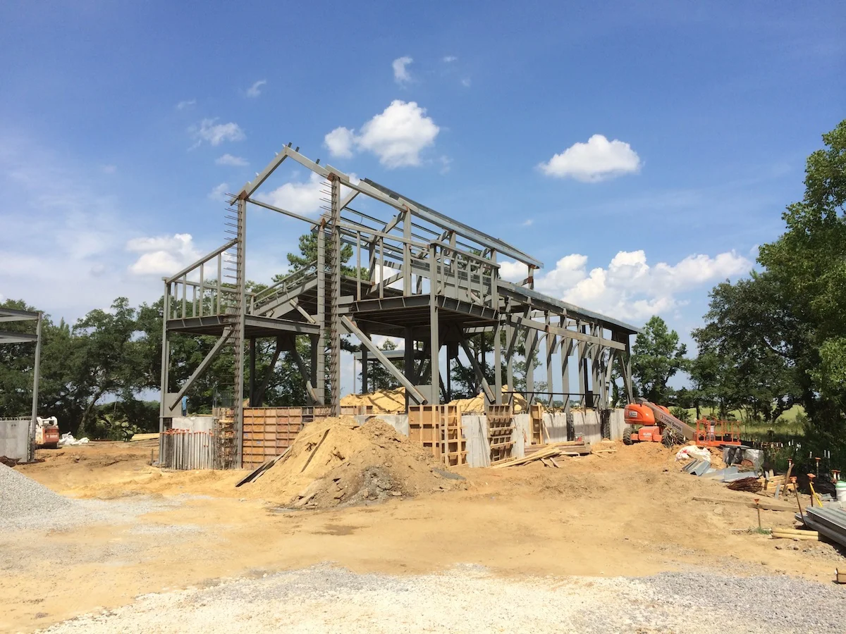 A construction photo of the chapel's steel frame.