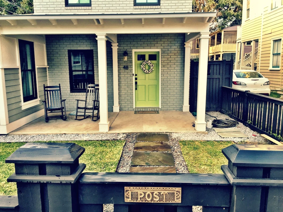 Detail picture of the gate with a very cool vintage brass mail slot.