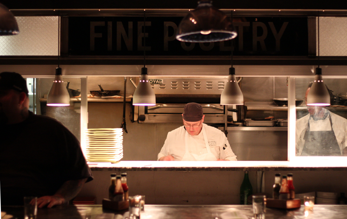 Remember when the kitchen was always hidden at restaurants? What were we thinking? Photo Credit: Miguel Buencamino