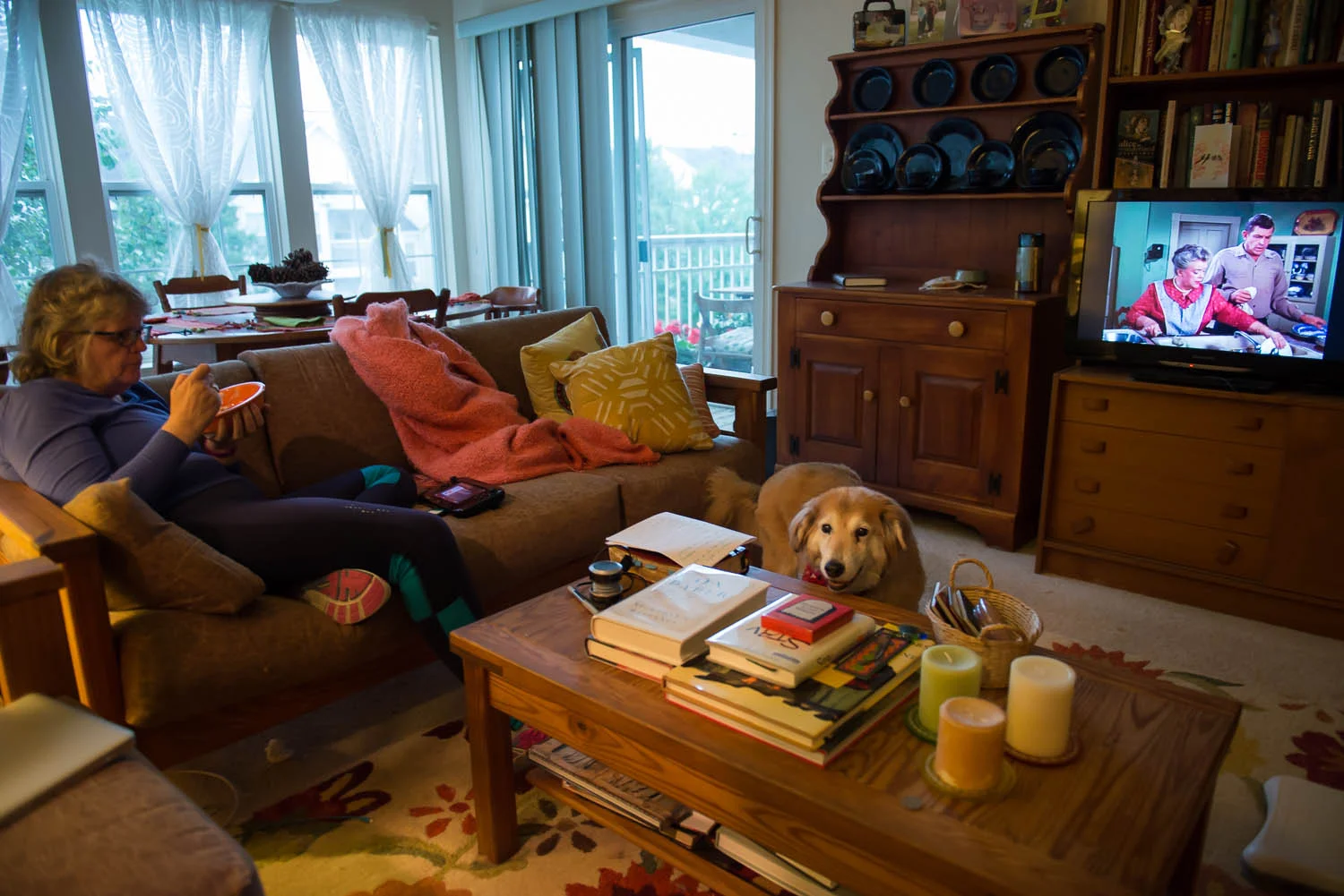 Joani Peacock eats while watching television after returning from her daily walk, at her home in Alexandria, Va., Friday, Oct. 3, 2014. Peacock, who is bipolar, walks regularly and is training to walk a half marathon because she says regular exercise helps her feel more balanced.